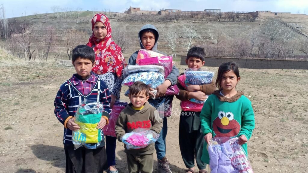 Afghan Children Receiving Winter Clothes by HBT